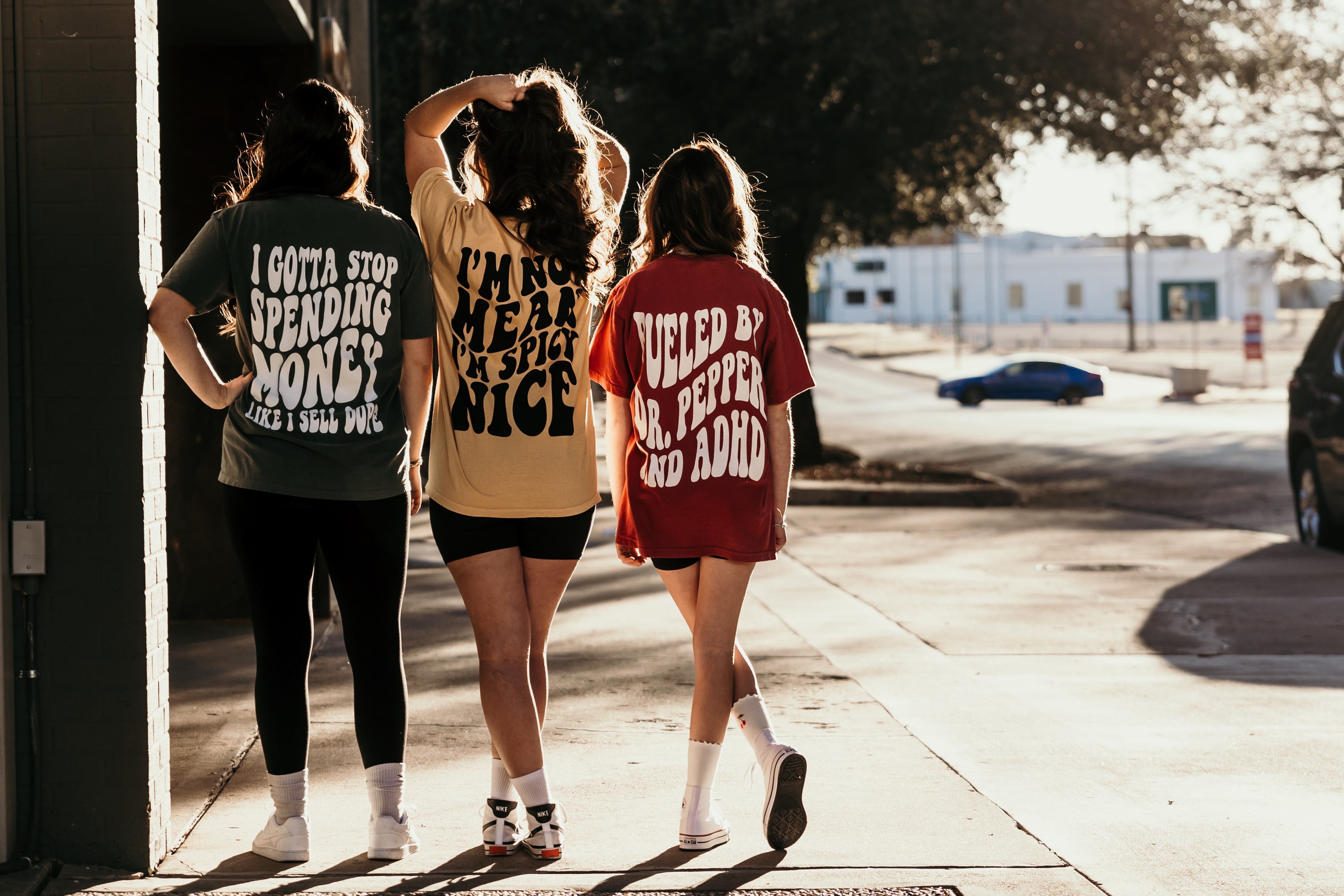 Black graphic t-shirt with "I'm Spicy Nice" design from Shop Karma Tees, casual style with bold text on front.