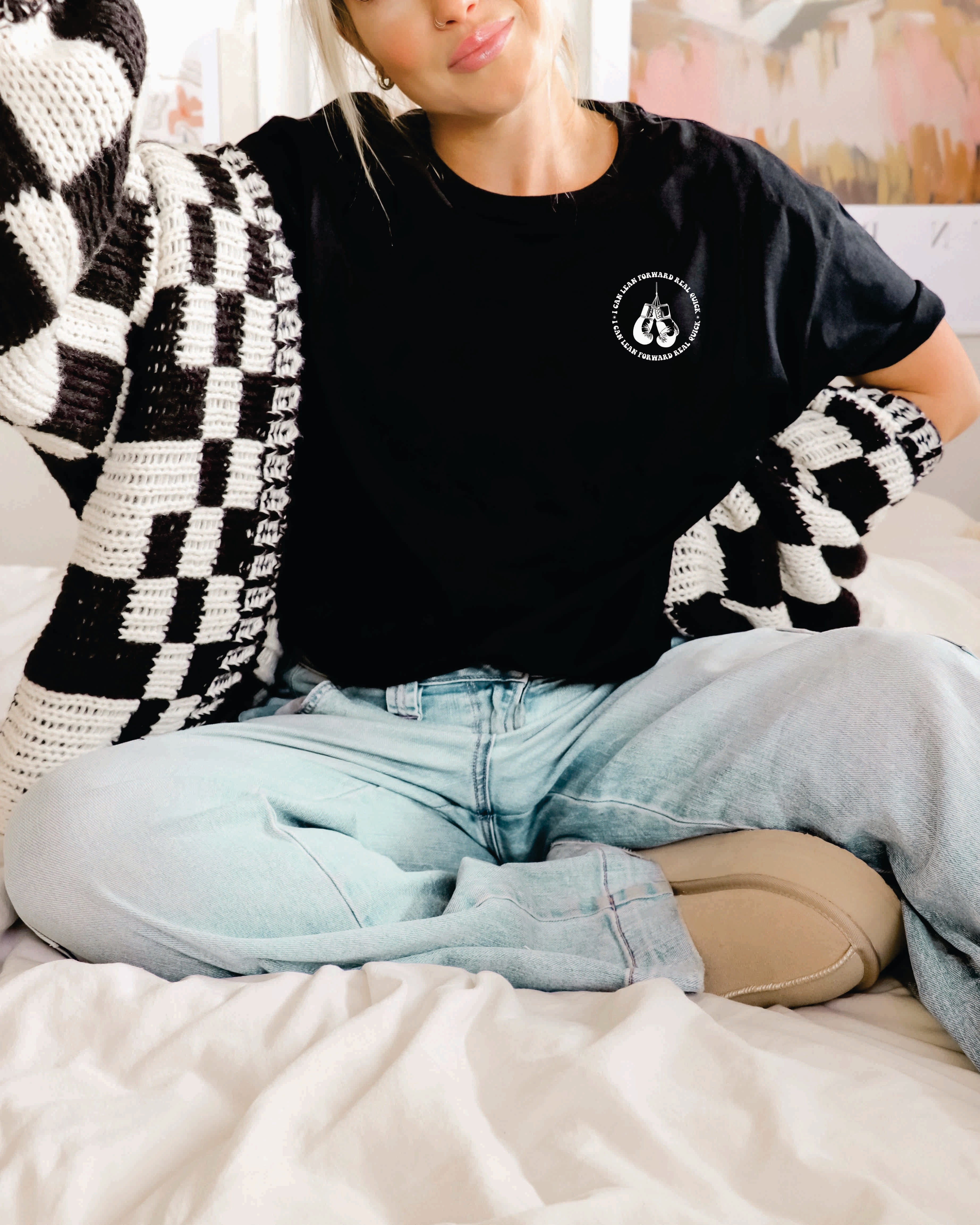 Black graphic t-shirt from Shop Karma Tees featuring the phrase "I Might Be Laid Back" in bold lettering.
