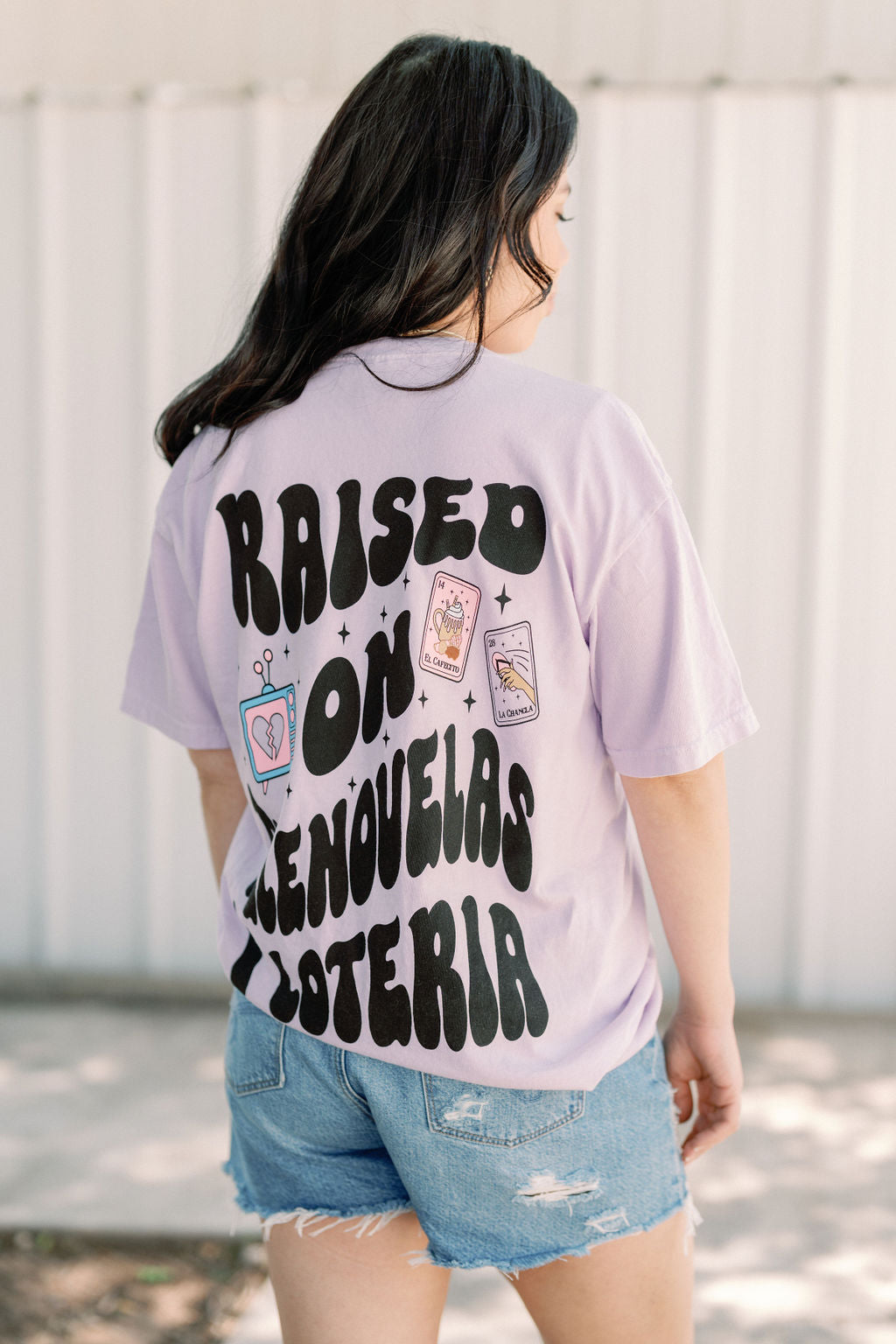 Loteria graphic T-shirt by Shop Karma Tees featuring colorful Loteria card designs on a casual cotton tee.