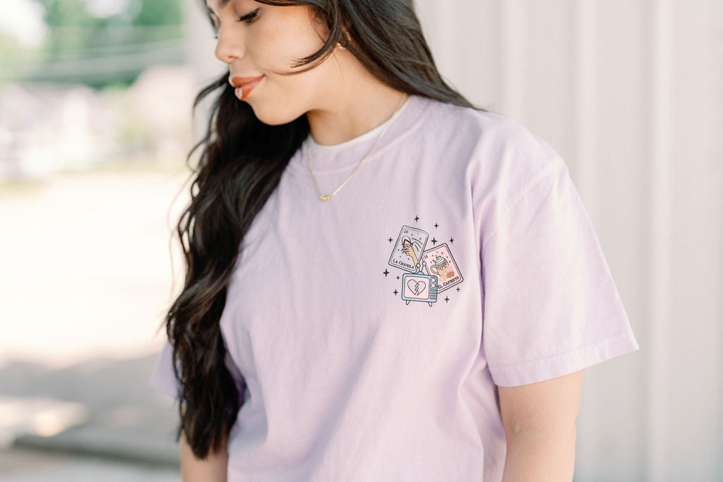 Loteria graphic T-shirt by Shop Karma Tees featuring colorful traditional Mexican Loteria card illustrations on a black tee.