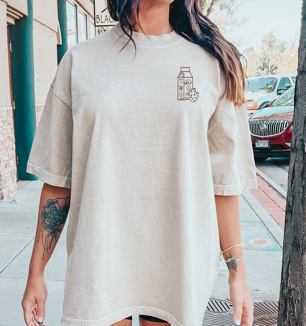 Front view of a graphic T-shirt featuring the "Milf and Cookies" design by Shop Karma Tees