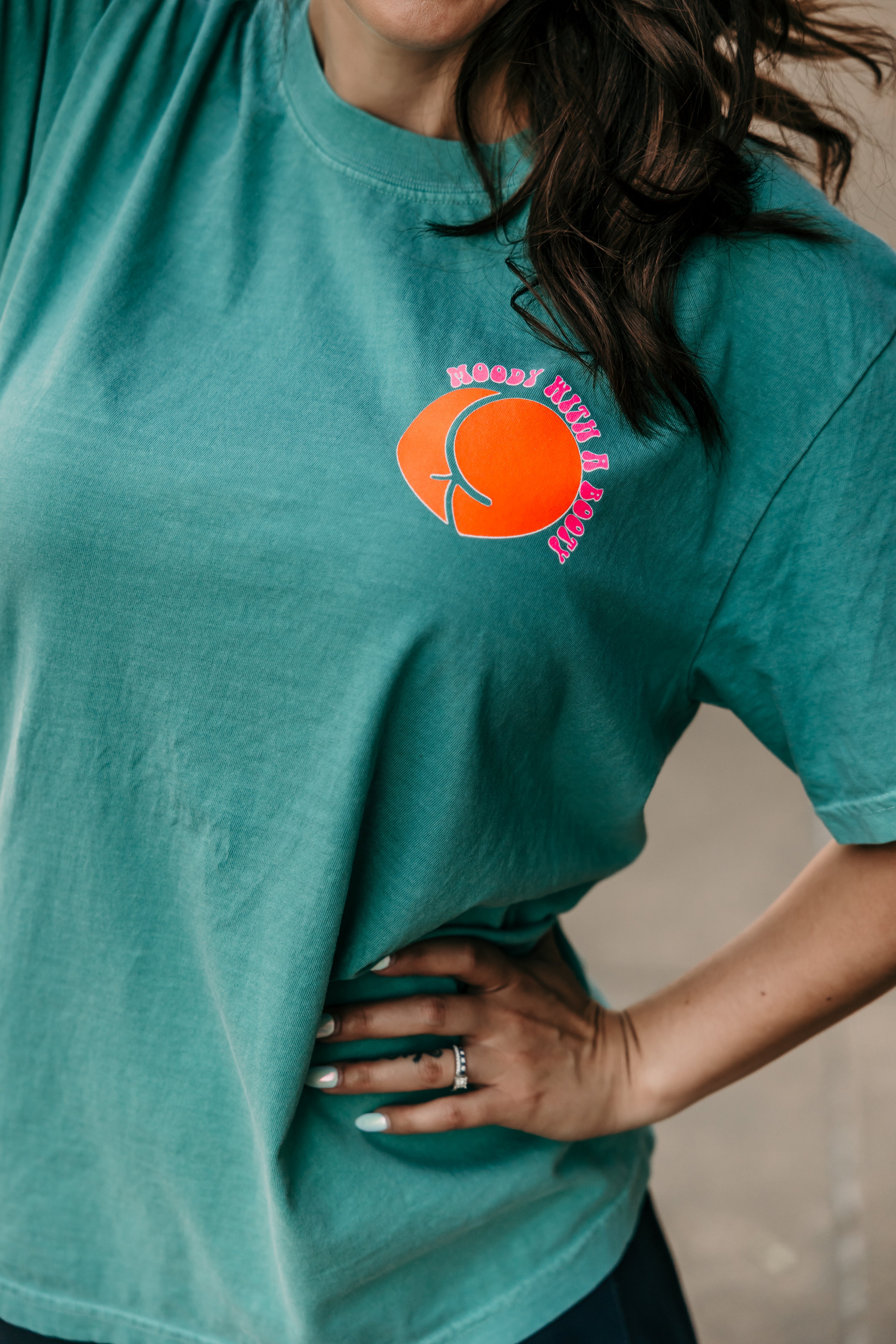 Moody with a booty graphic T-shirt from Shop Karma Tees featuring a bold, colorful design on soft cotton fabric.