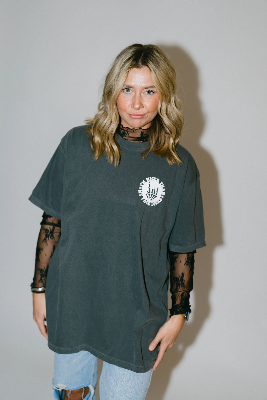 Black graphic T-shirt from Shop Karma Tees with the slogan "Nicer Than My Face Looks" printed on the front.