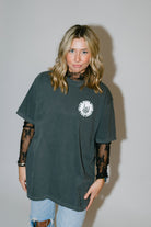 Black graphic T-shirt from Shop Karma Tees with the slogan "Nicer Than My Face Looks" printed on the front.