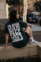 Black graphic T-shirt from Shop Karma Tees with humorous "Nicer Than My Face Looks" design on the front.