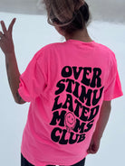 Overstimulated Moms Club graphic tee by Shop Karma Tees showing a casual cotton t-shirt with bold printed design on front