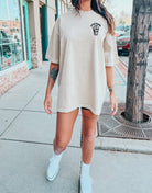Black graphic t-shirt featuring a bold ray design from Shop Karma Tees, displayed flat with a focus on the front print.