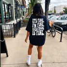 It's Fine graphic tee from Shop Karma Tees featuring a humorous design on a casual cotton shirt.