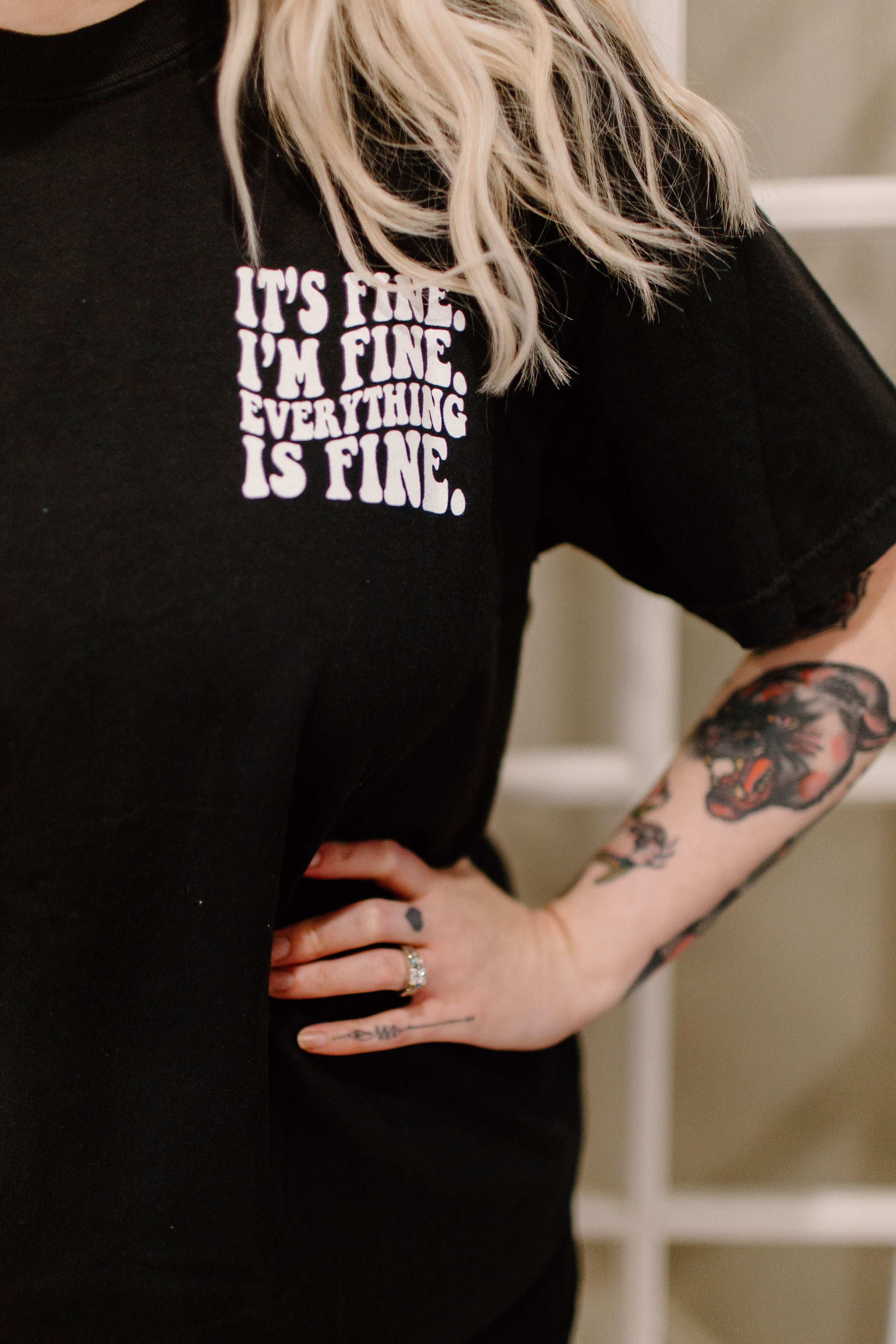 It's Fine graphic tee by Shop Karma Tees featuring a stylish design on soft fabric, perfect for casual wear.