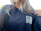 It's Fine graphic sweatshirt from Shop Karma Tees with a bold "It's Fine" print on the front.