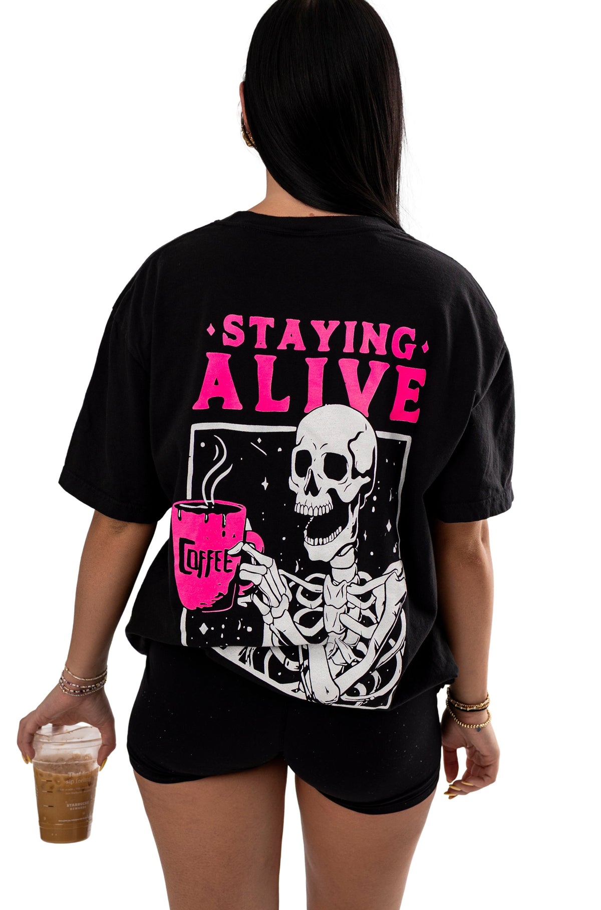 Small Shop Karma Tees Staying Alive short-sleeve graphic T-shirt displayed on a hanger.