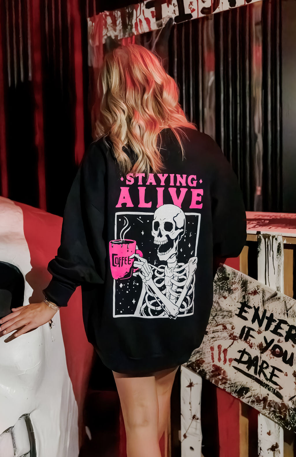 Small black short-sleeve T-shirt from Shop Karma Tees featuring the Staying Alive design.