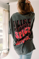 Spicy Books graphic T-shirt by Shop Karma Tees featuring a bold spicy books design in black on a casual tee.
