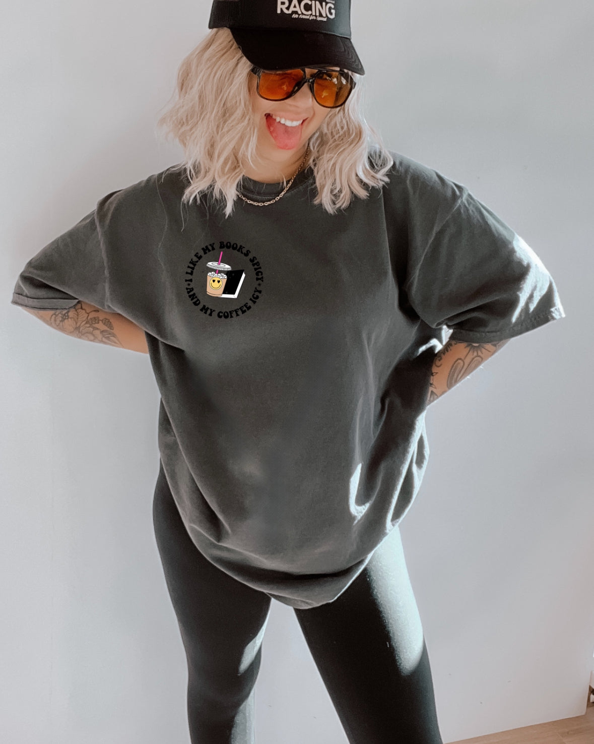 Spicy Books graphic T-shirt from Shop Karma Tees featuring colorful book illustrations and bold text design.