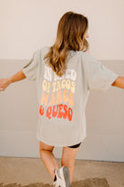 Graphic T-shirt featuring tacos and margaritas design, casual fit, by Shop Karma Tees, shown on model with vibrant print.