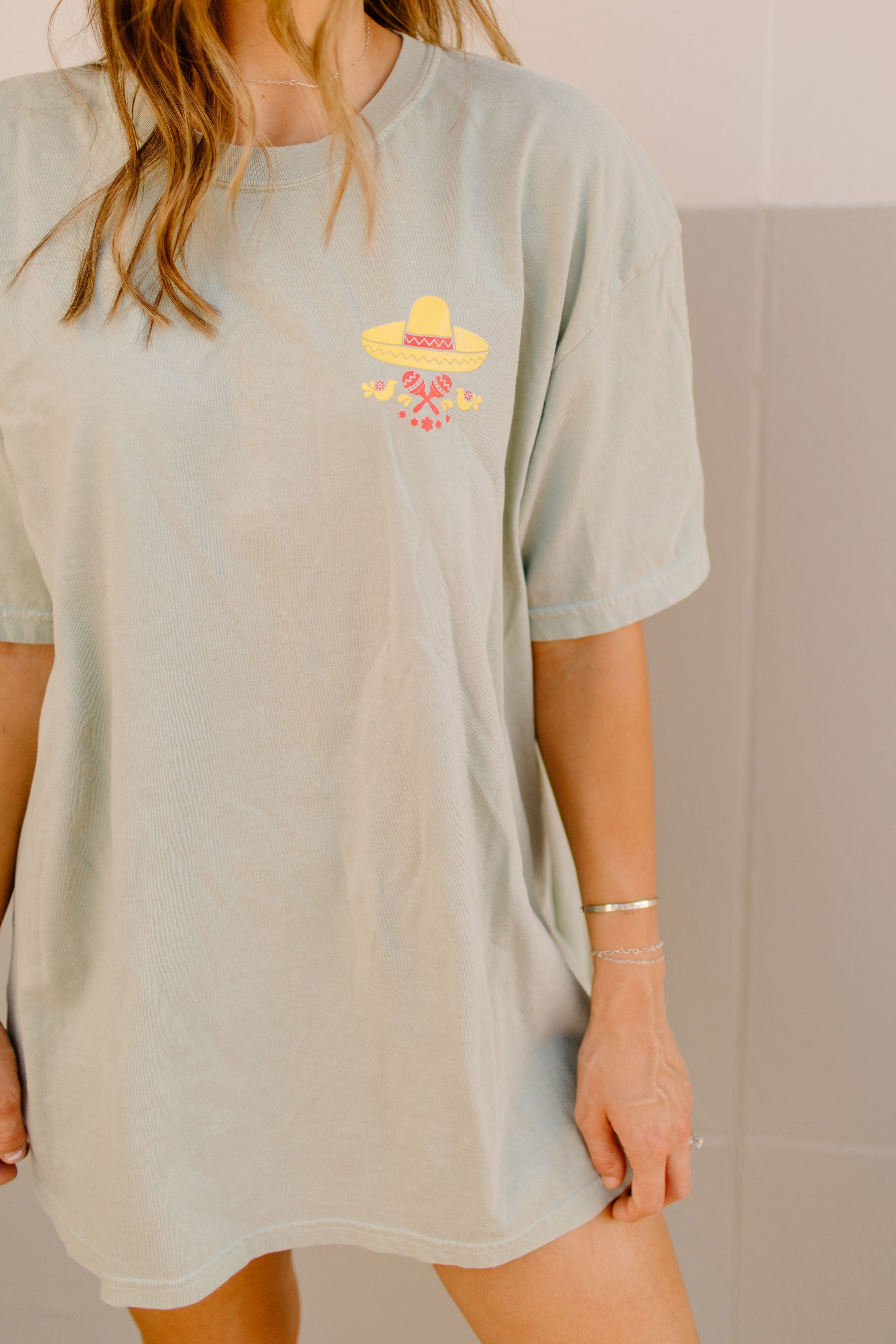Graphic T-shirt featuring tacos and margaritas design from Shop Karma Tees, casual apparel with colorful food-themed print.