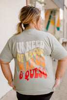 Graphic T-shirt featuring tacos and margaritas design from Karma Tees, casual fit, colorful print, perfect for summer wear.