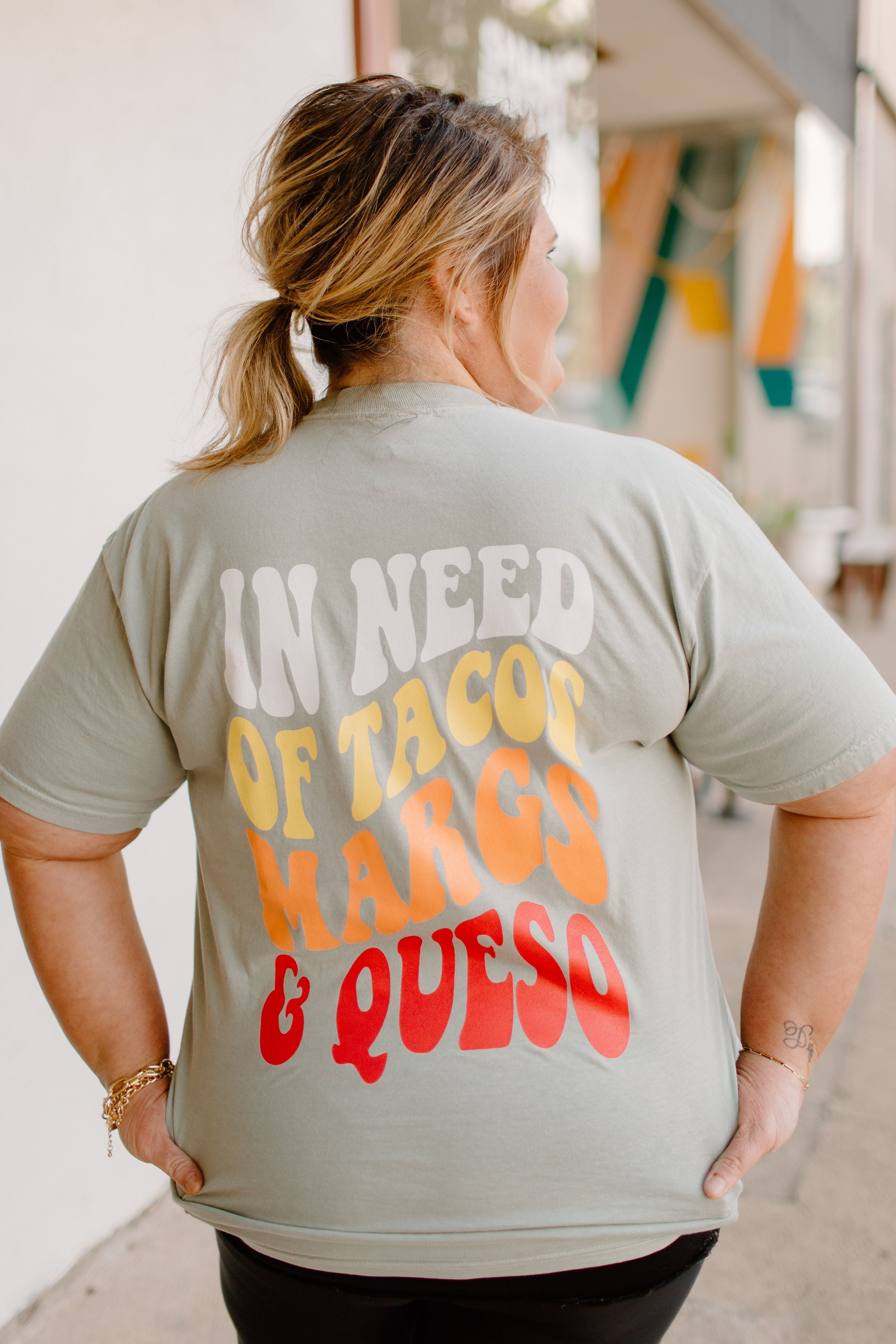 Graphic T-shirt featuring tacos and margaritas design from Karma Tees, casual fit, colorful print, perfect for summer wear.
