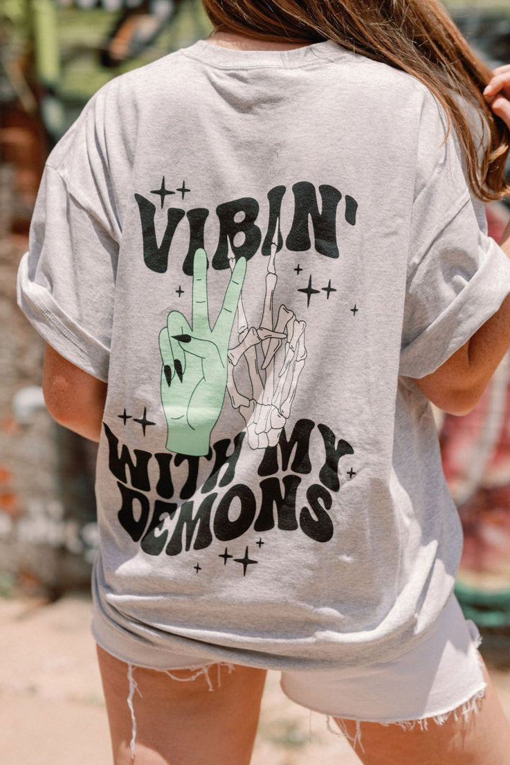 Vibin' graphic T-shirt from Shop Karma Tees featuring a colorful, trendy design on a casual cotton tee.