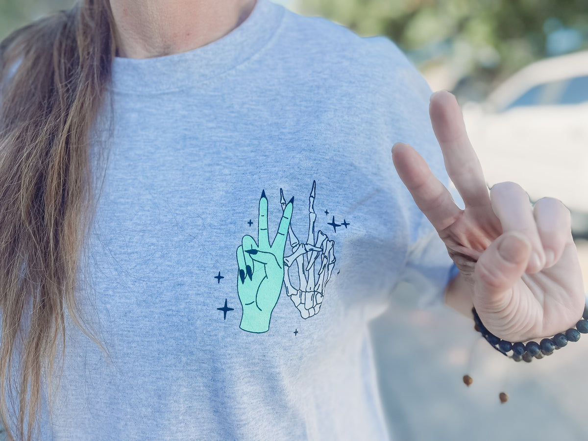 Vibin' Graphic Tee from Shop Karma Tees featuring a colorful, trendy t-shirt design on a casual cotton shirt.