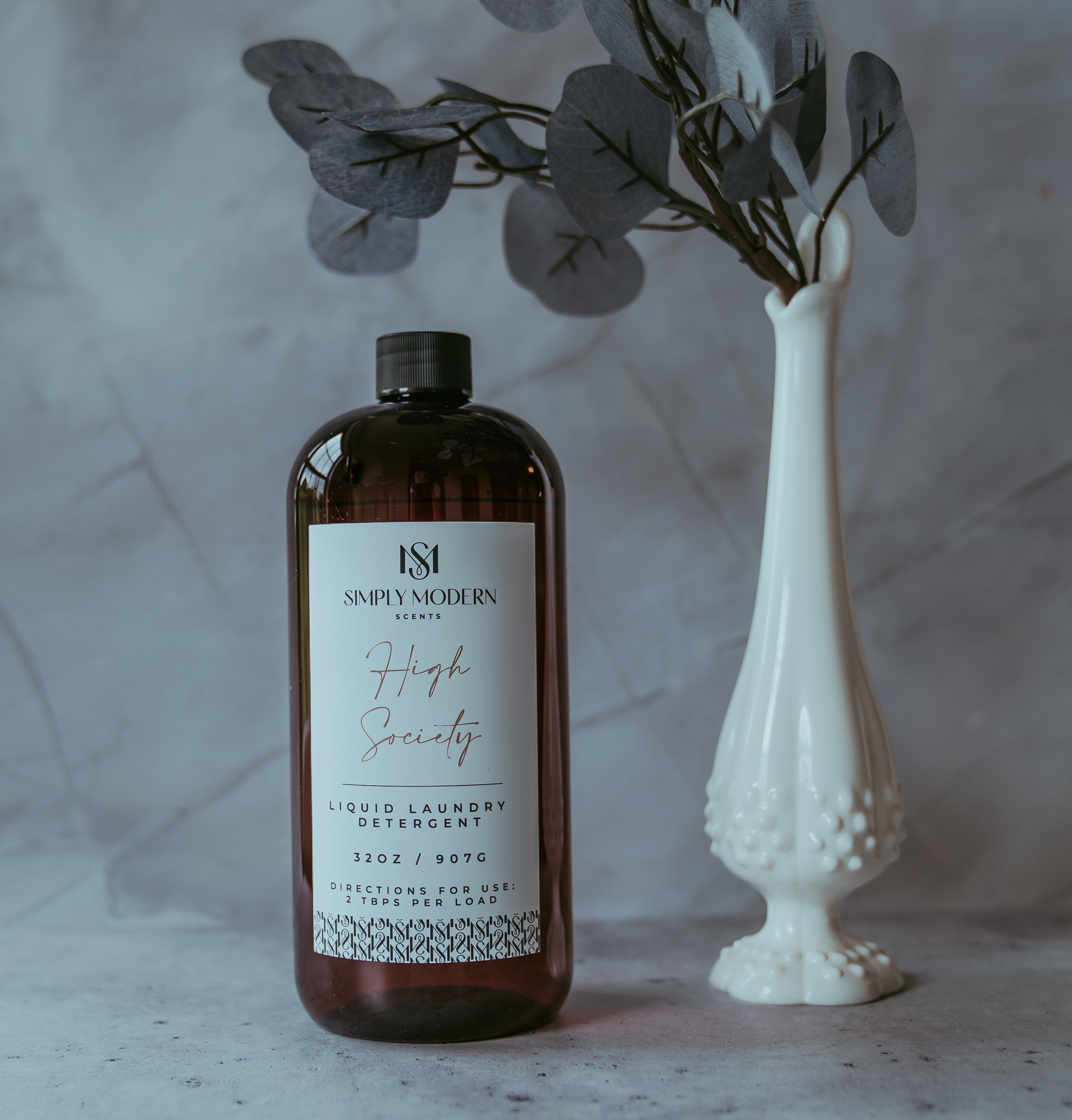 Simply Modern Scents 32oz luxury laundry detergent bottle with Midnight Tide scent, designed for fresh, clean laundry.