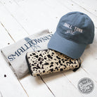 Lake blue twill dad hat with "Small Town Girl" embroidery, relaxed fit, by The Graphic Tee, shown on a neutral background.