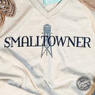 Unisex Smalltowner V-Neck SS Graphic Tee by The Graphic Tee, showing a comfortable fit and stylish design on a plain background.