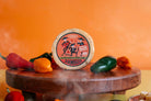 Smoked 3 Amigos spicy Gouda cheese by Cheese Brothers, Inc., showing a block of cheese with smoked and spicy flavor details.