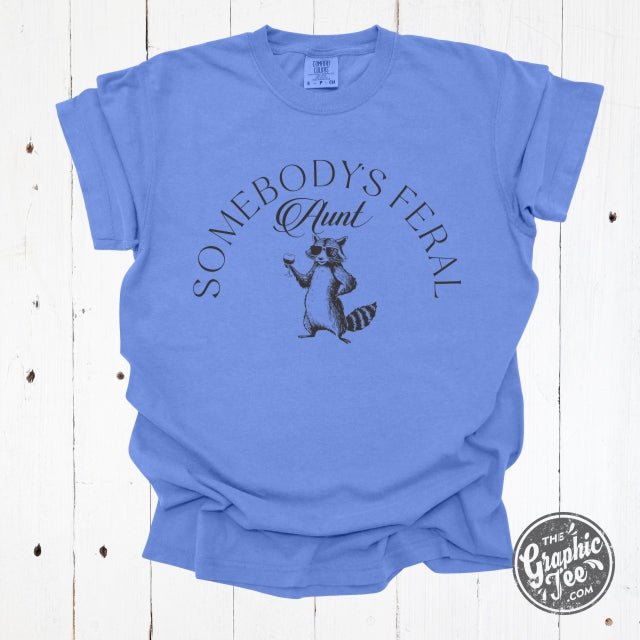 Somebody's Feral Aunt graphic T-shirt in pigment dye, featuring a casual short-sleeve design with bold print on the front.