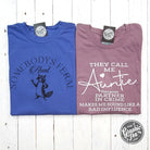 Somebody's Feral Aunt graphic tee in pigment dye, featuring a casual short-sleeve design with bold text and unique distressed fabric.