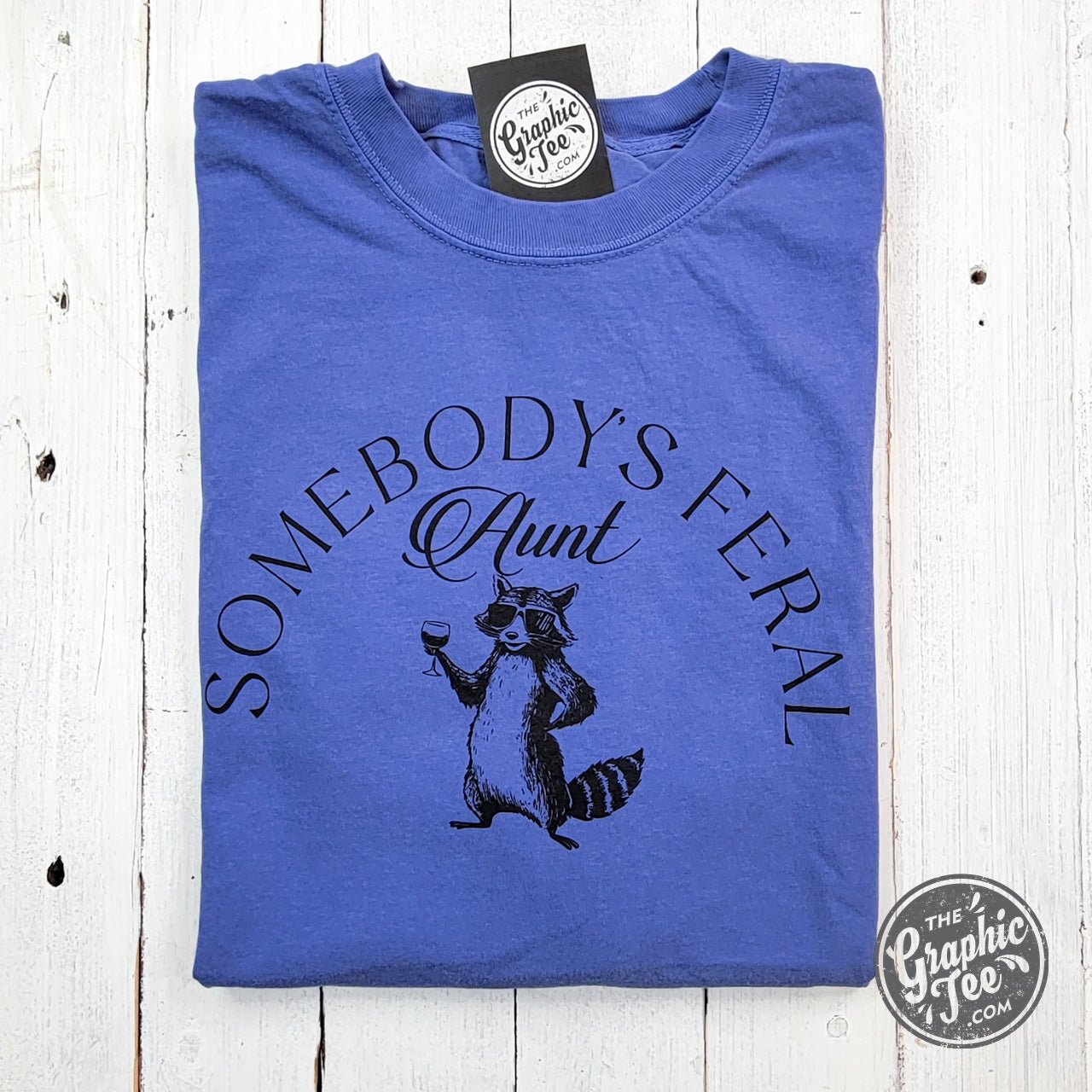 Somebody's Feral Aunt pigment-dyed SS graphic T-shirt featuring a relaxed fit with bold printed design on soft fabric.