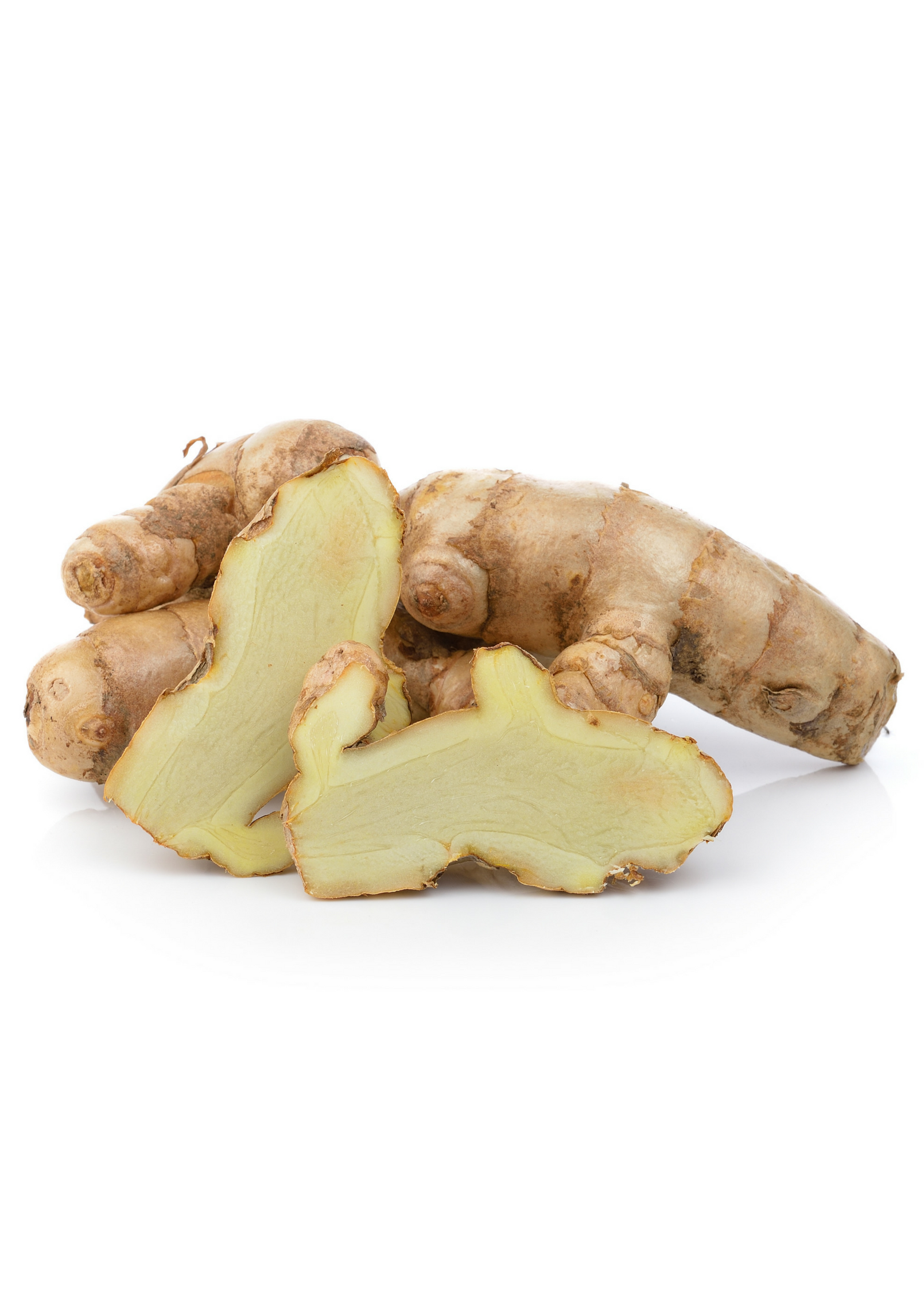 White turmeric herb in a coconut coir pot, grown by Sow Exotic, showing fresh root and leafy green parts.