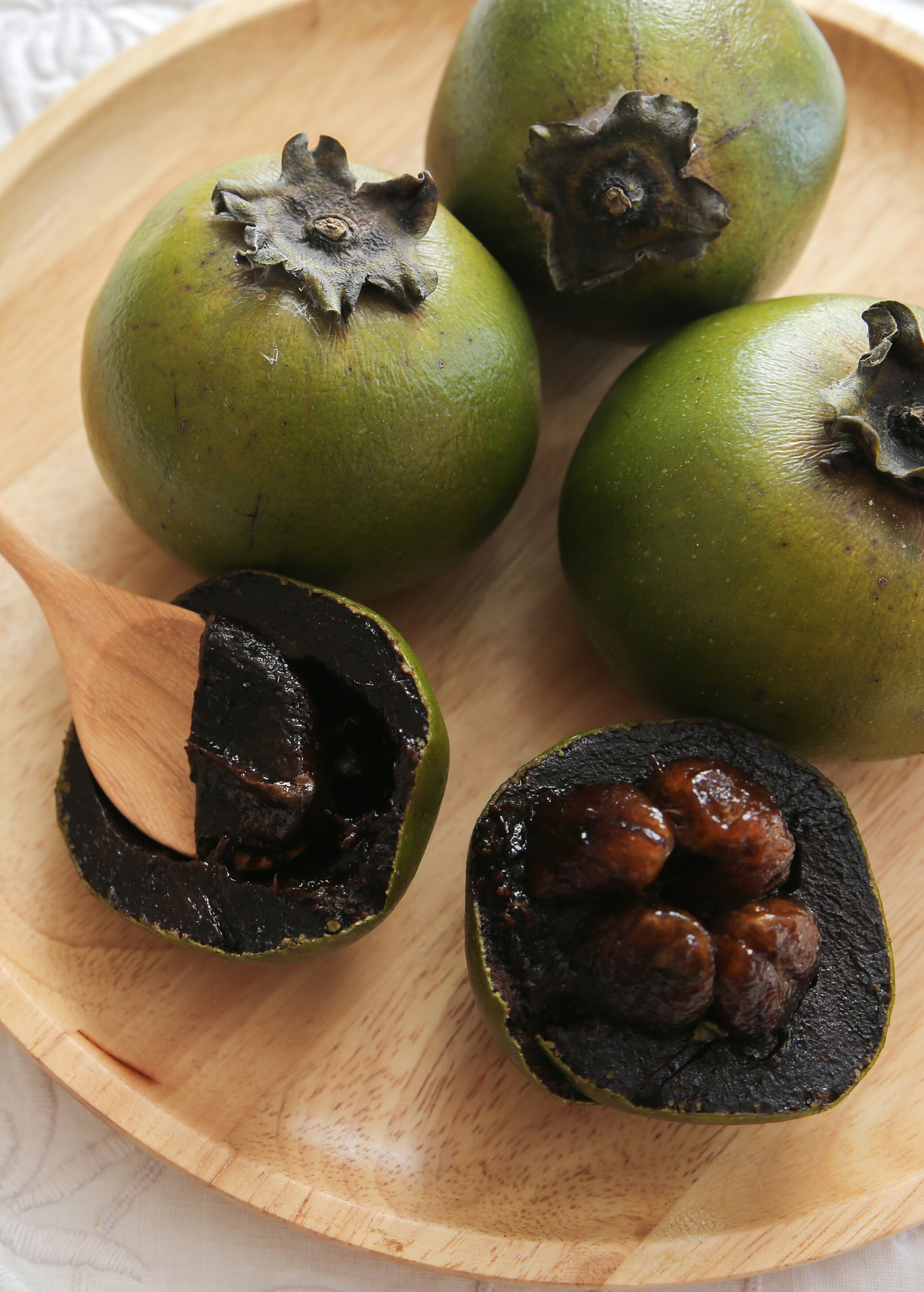 Black Sapote seedling in a coconut coir pot, tropical fruit tree by Sow Exotic, showing healthy green foliage and seedling growth.