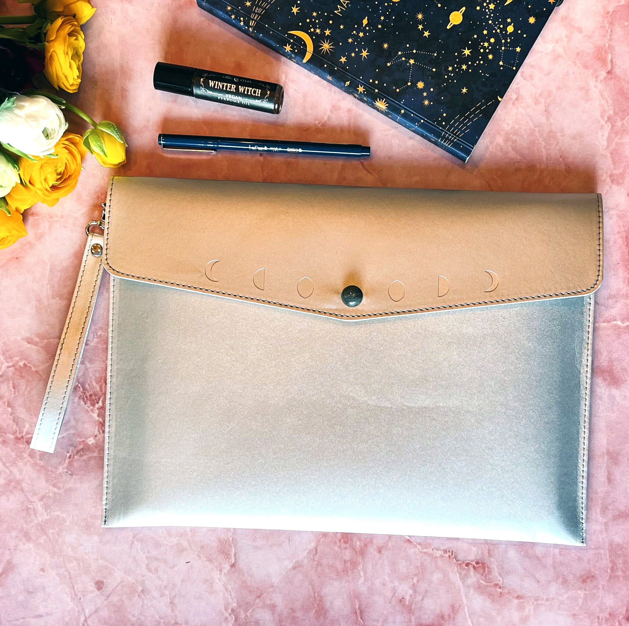 Navy Moon Phases clutch purse by Spirit Nest featuring a celestial moon phase design in accessories style
