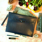 Navy Moon Phases Clutch Purse by Spirit Nest, stylish accessories with celestial moon phase design.