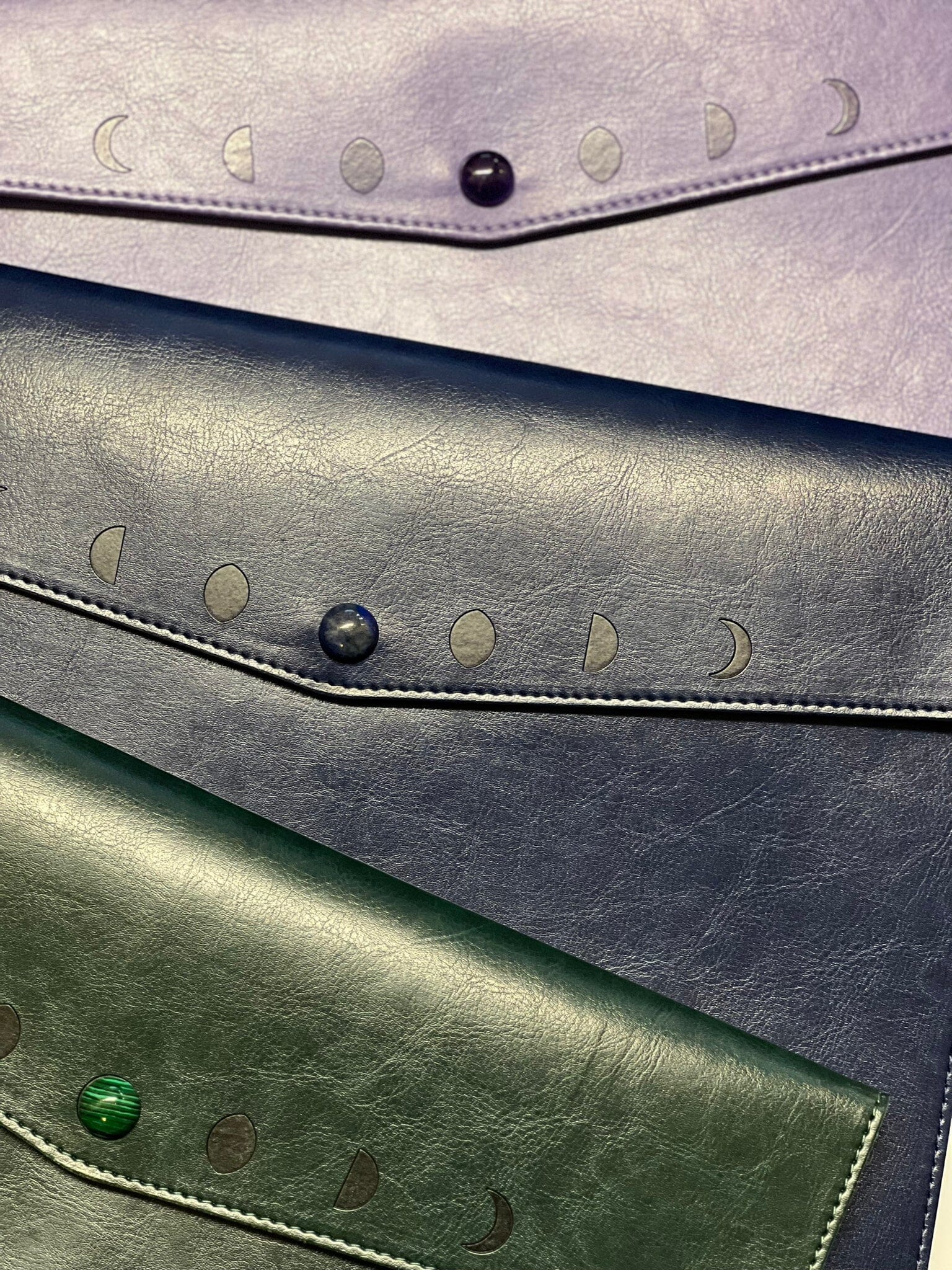 Navy Moon Phases Clutch Purse by Spirit Nest, accessories with celestial moon phase design and zip closure.