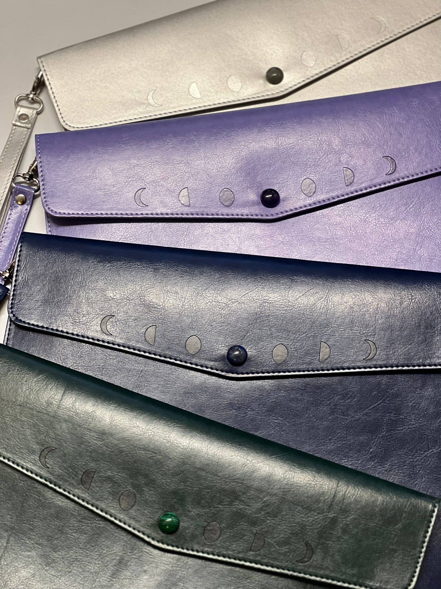 Navy Moon Phases clutch purse by Spirit Nest, featuring celestial moon phase designs, casual accessories for stylish outfits.