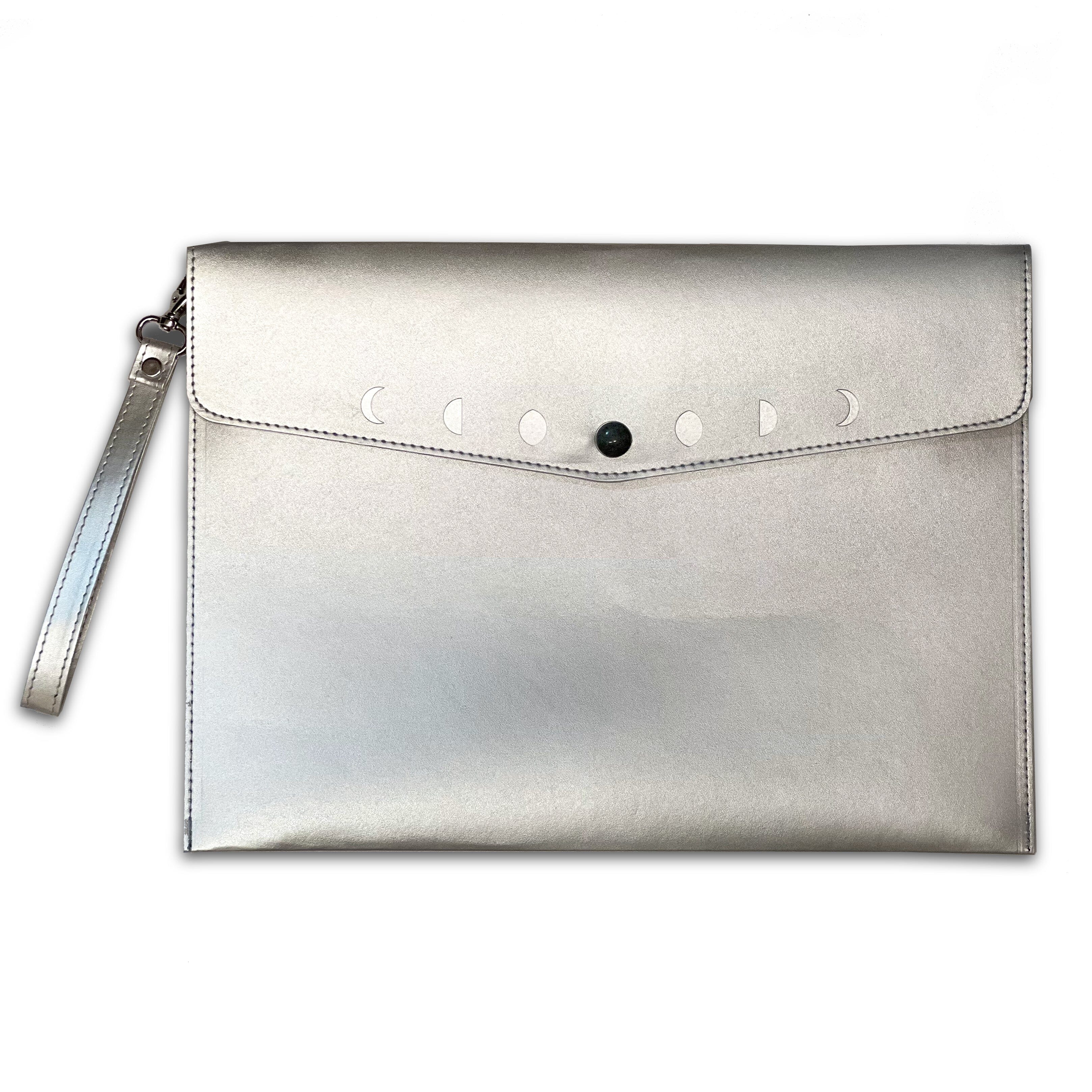 Navy Moon Phases clutch purse by Spirit Nest, featuring celestial moon phase designs, made from soft textured accessories material.