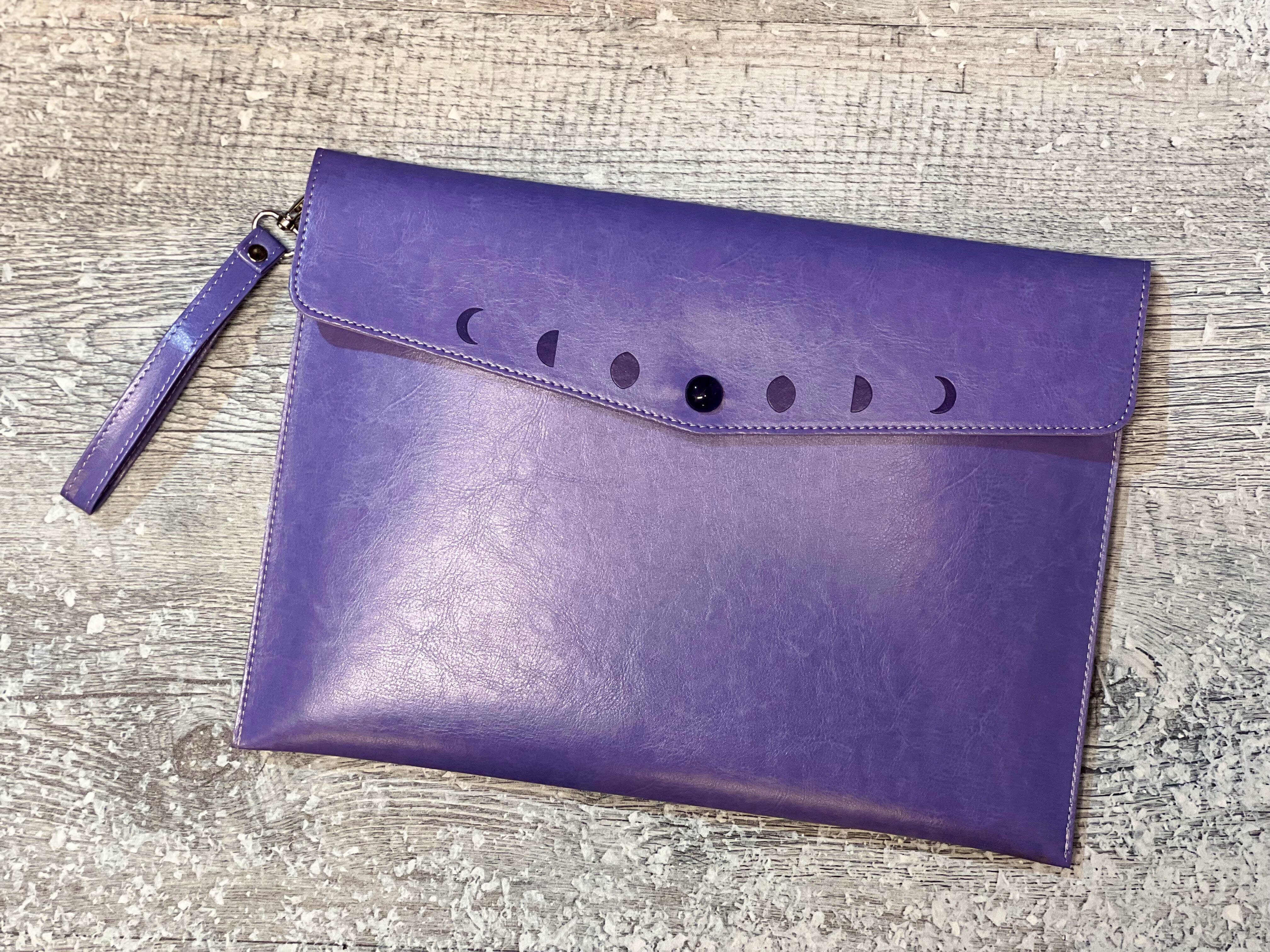 Navy moon phases clutch purse by Spirit Nest, stylish accessories with celestial moon phase design for women.