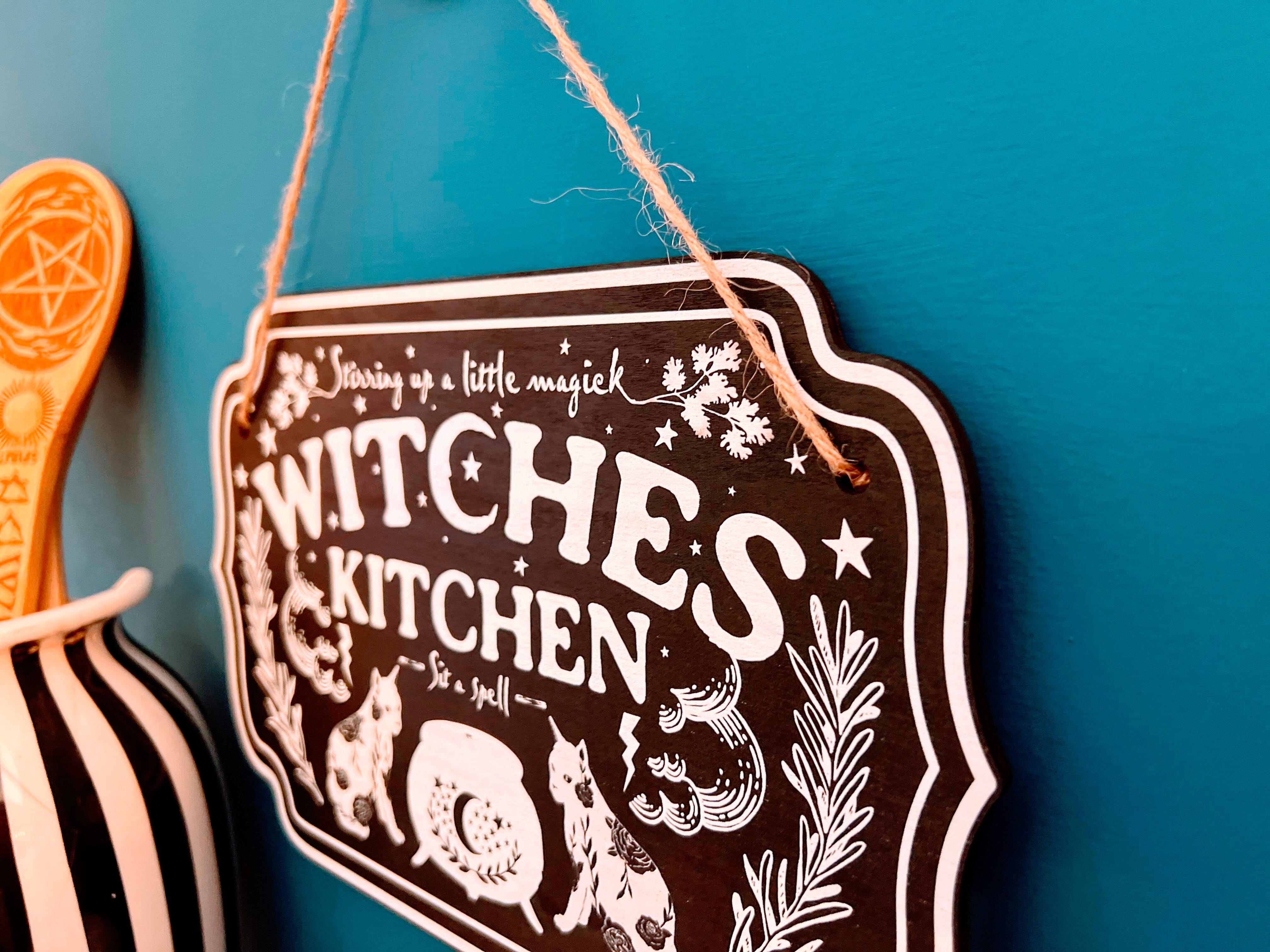 Wooden witchy décor sign with "Witches Kitchen" text, crafted by Spirit Nest, for home Halloween or witch-themed décor.