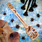 Spirit Nest The 5 Elements Bamboo Large Kitchen Utensils Set featuring spatulas, spoons, and cooking tools on a kitchen surface.