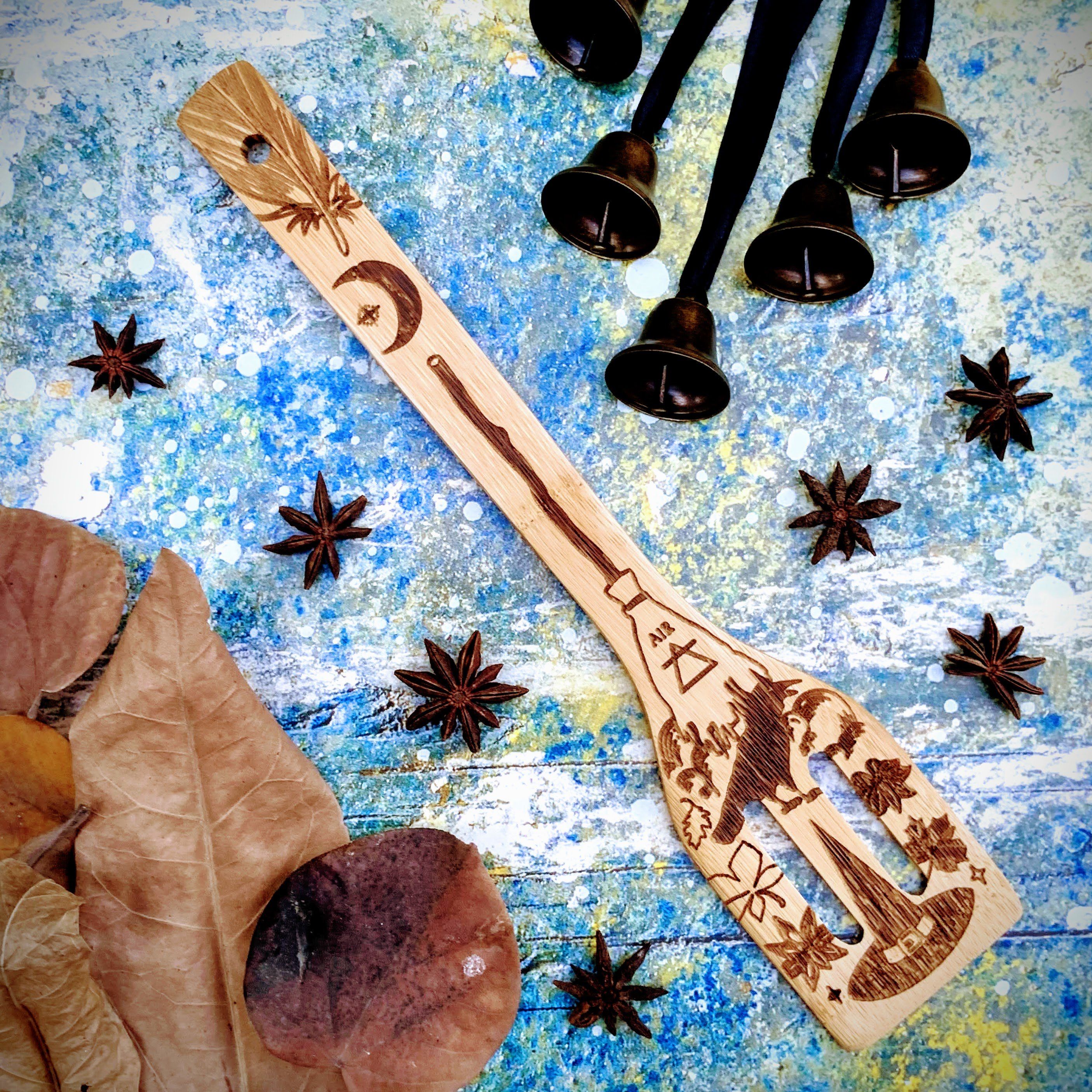 Spirit Nest The 5 Elements Bamboo Large Kitchen Utensils Set featuring spatulas, spoons, and cooking tools on a kitchen surface.