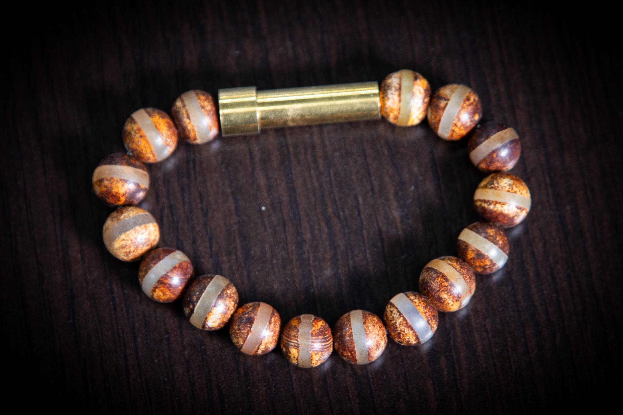 Silver Tibetan Agate bead cremation bracelet by Spirit Pieces, designed for hair, fur, or ashes, with clear stripe accents.