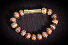Silver Tibetan Agate bead cremation bracelet by Spirit Pieces, designed for hair, fur, or ashes, with clear stripe accents.