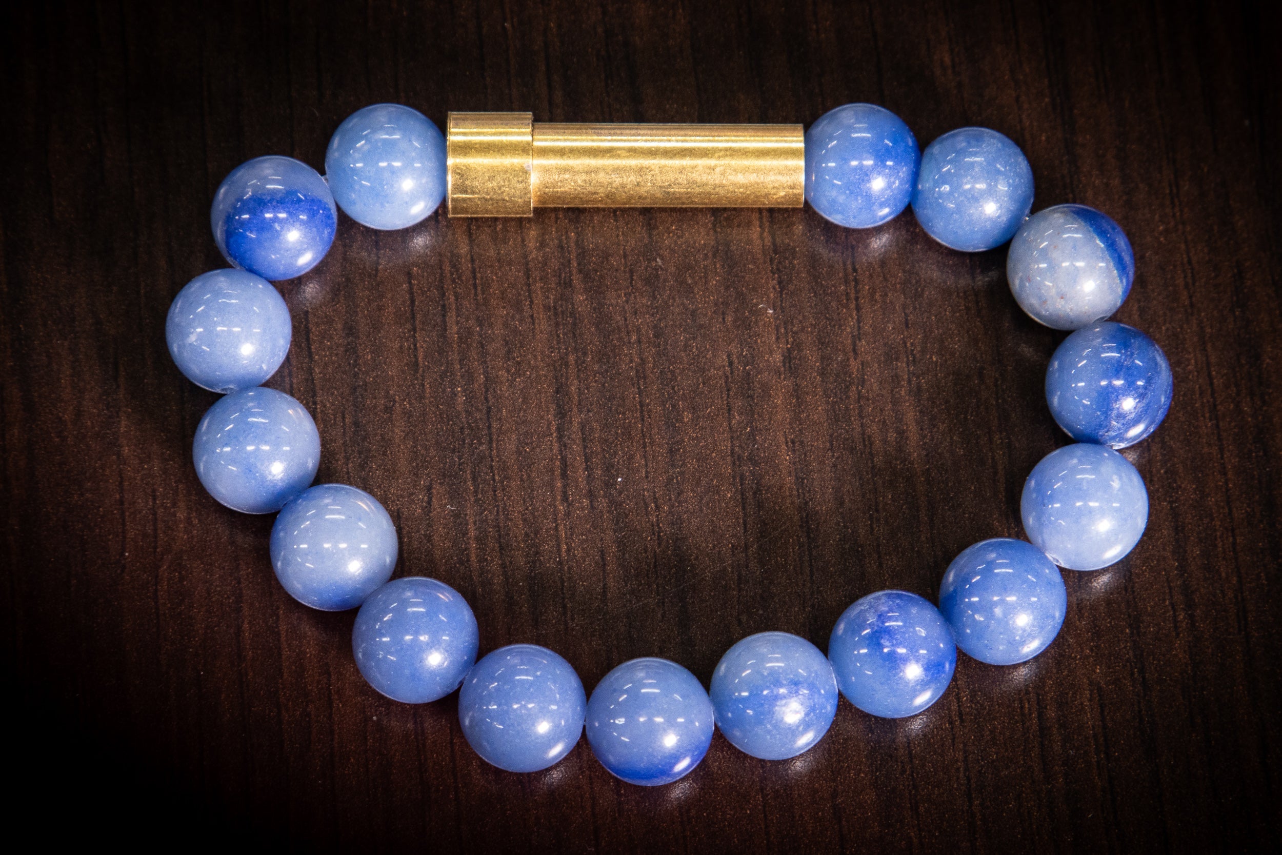 Silver cremation jewelry bracelet with blue apatite stones, designed for hair, fur, or ash keepsakes by Spirit Pieces.