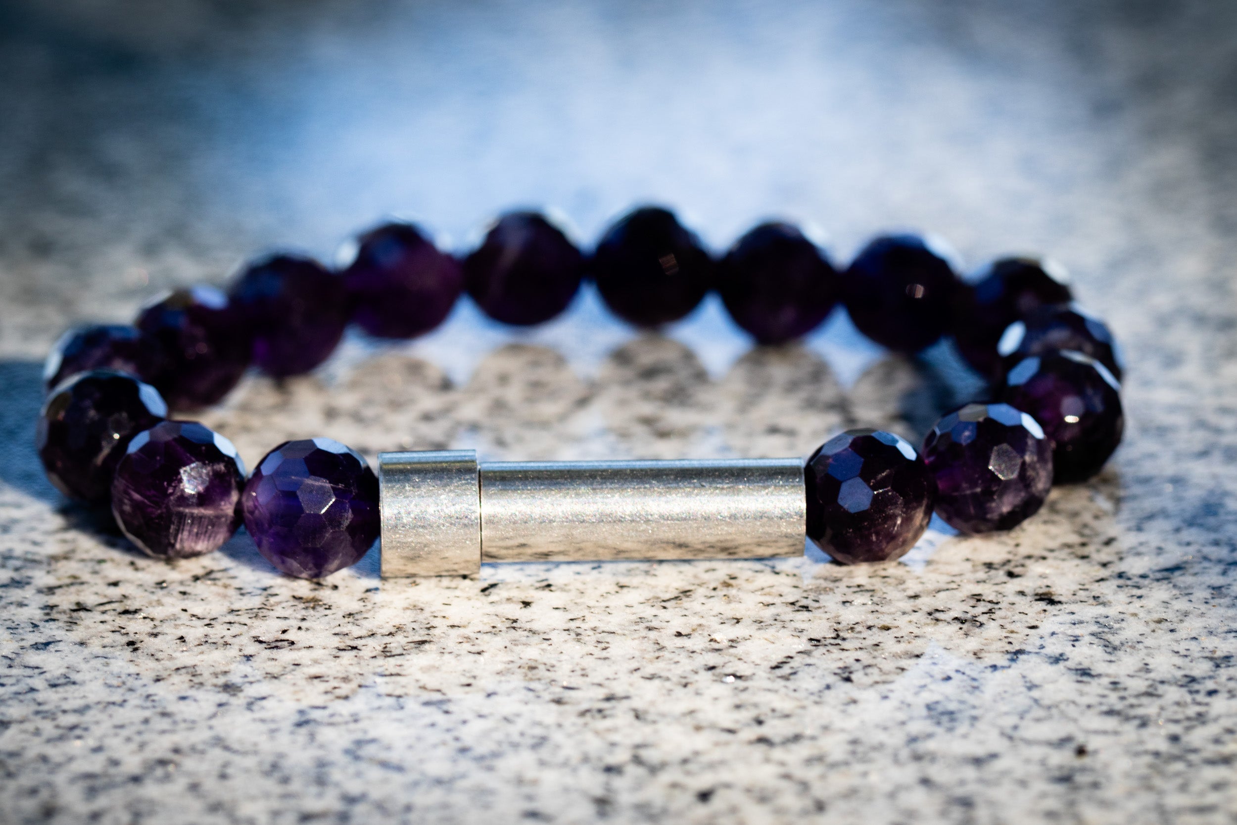 Silver faceted amethyst cremation bracelet by Spirit Pieces, designed for hair, fur, or ash, with a delicate, elegant style.