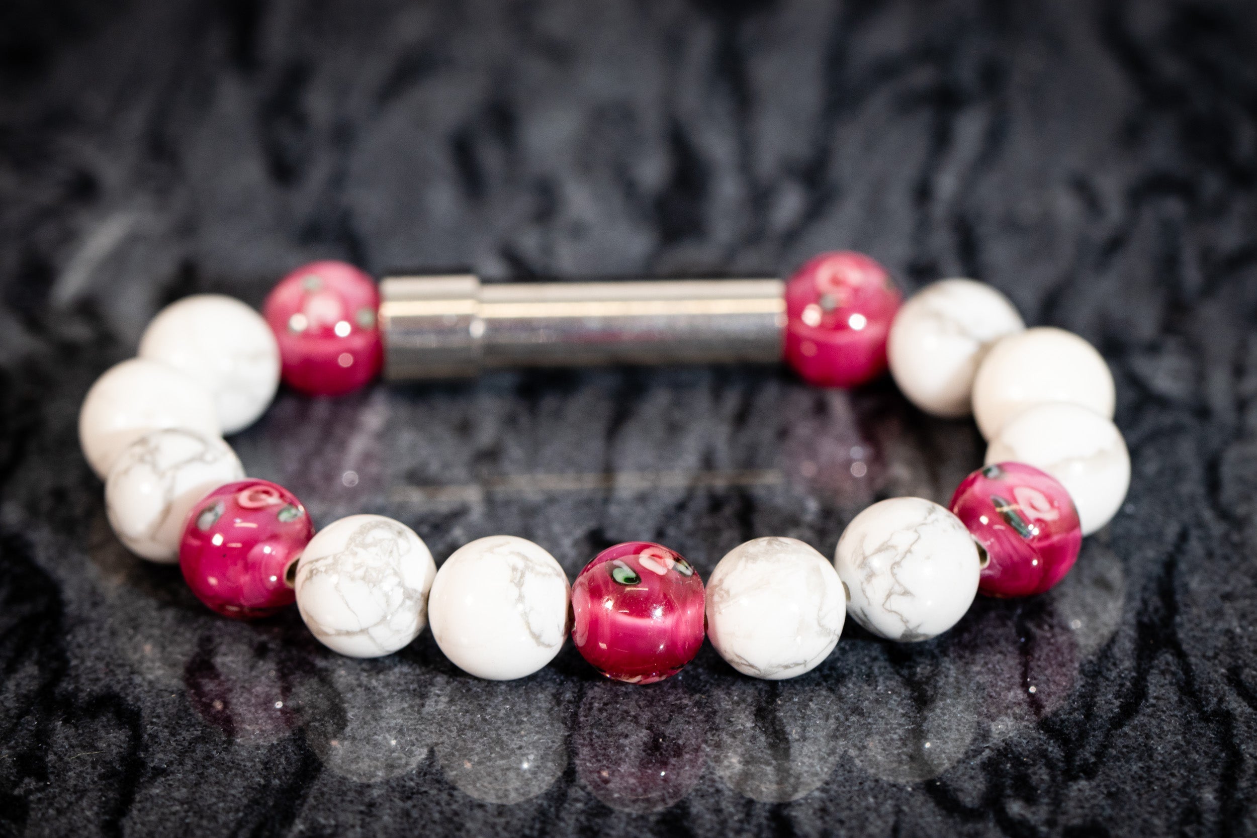 Silver cremation jewelry bracelet with Howlite and flower beads, designed for hair, fur, or ash keepsakes.