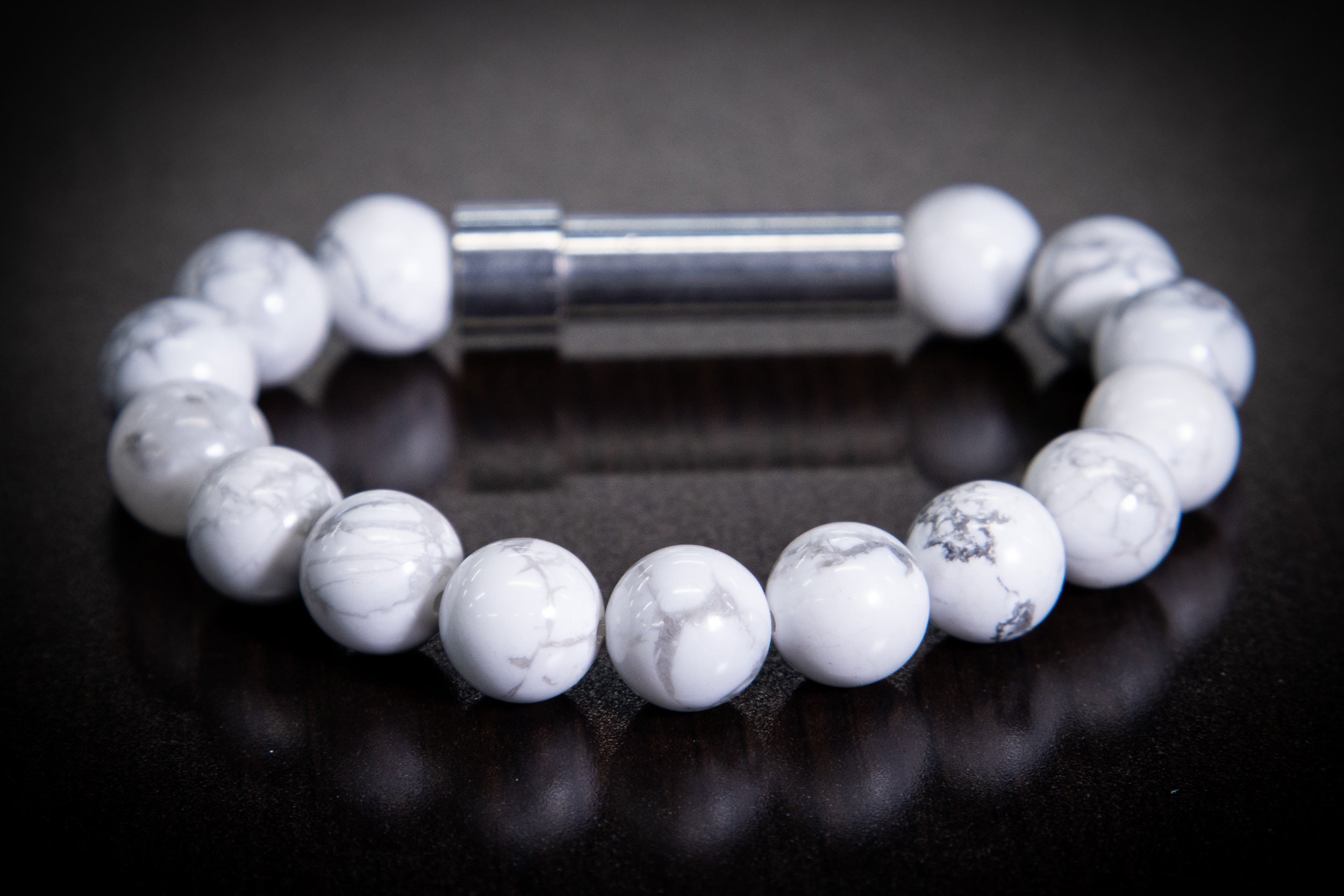 Silver Howlite healing bracelet by Spirit Pieces, cremation jewelry for hair, fur, or ashes, featuring polished stone beads.