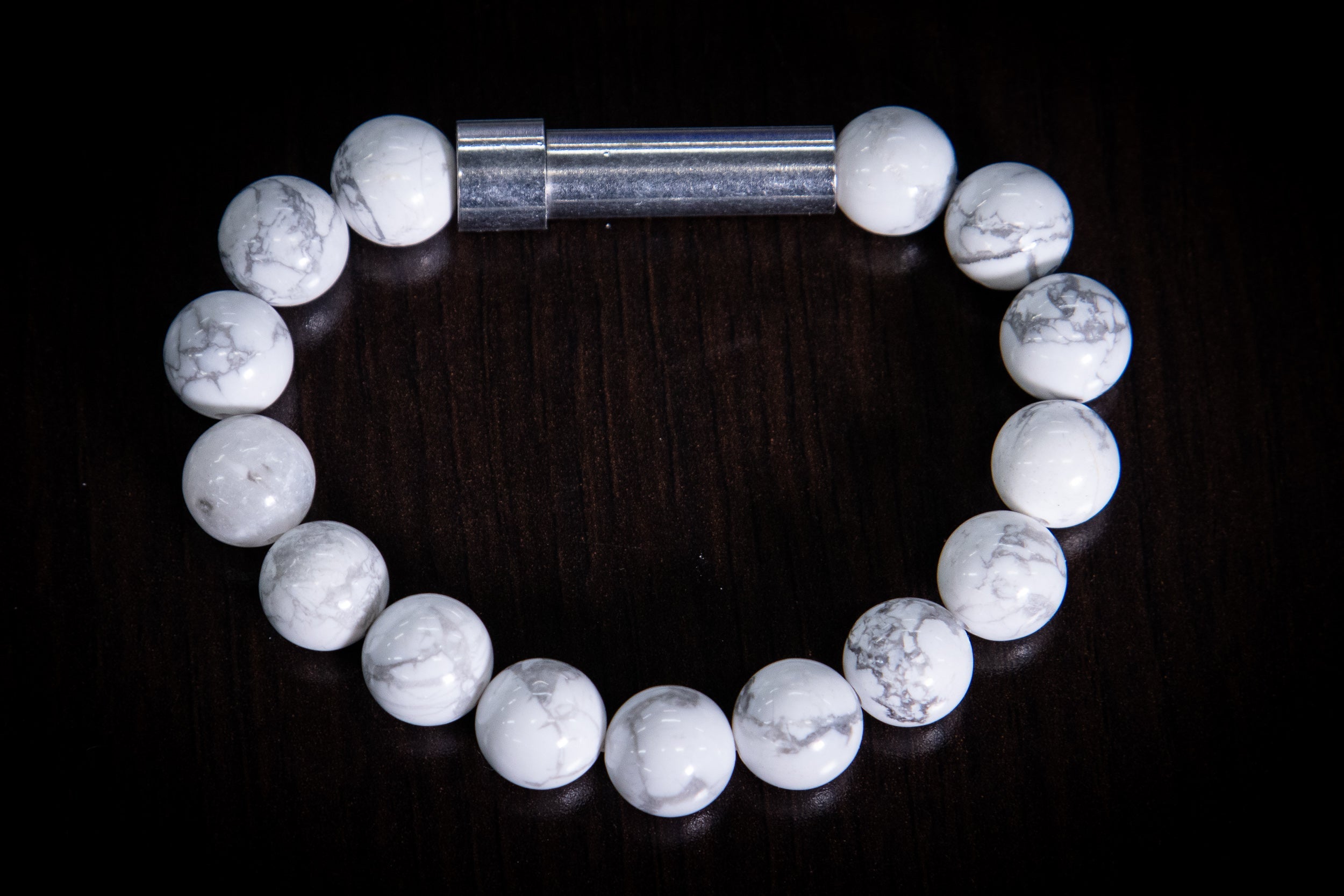 Silver Howlite healing bracelet by Spirit Pieces, cremation jewelry for hair, fur, or ash, featuring polished stone beads.