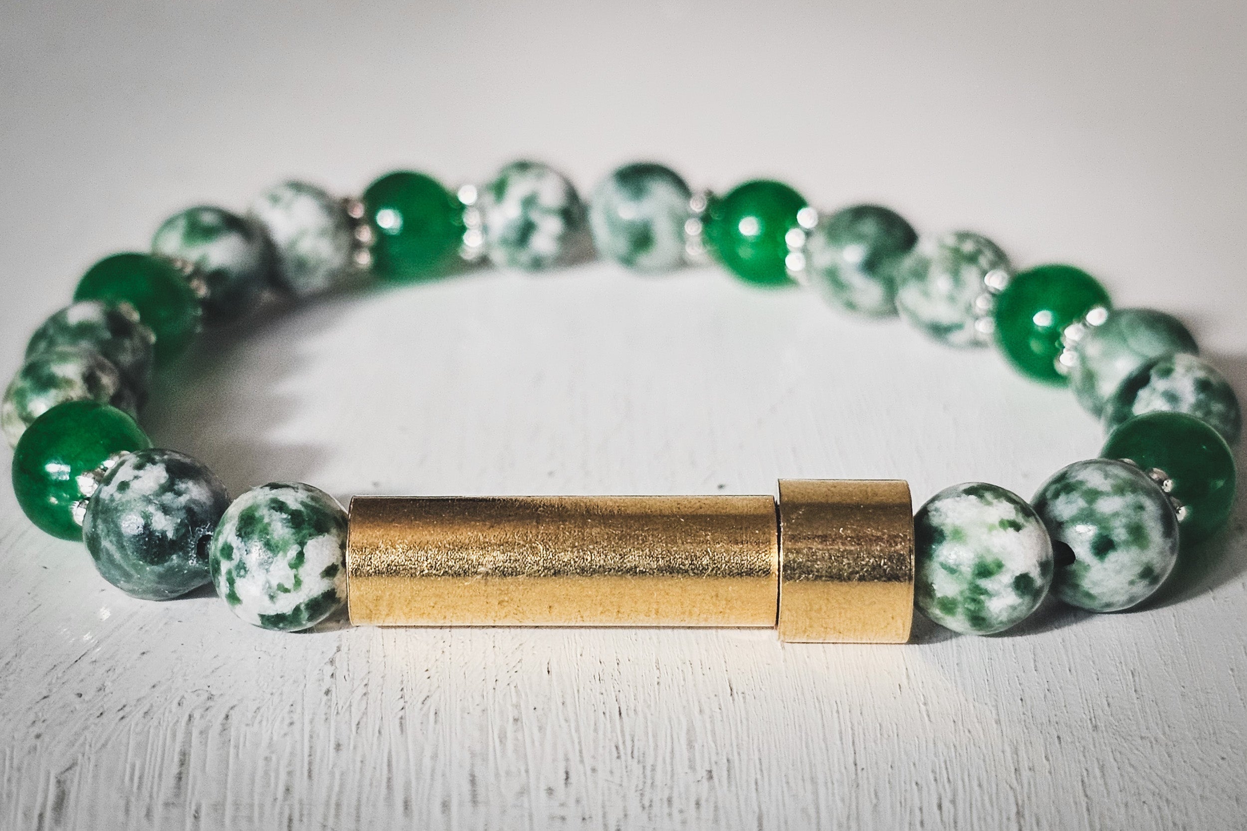 Silver cremation jewelry bracelet with jade and tree agate stones, designed for hair, fur, or ashes, by Spirit Pieces.